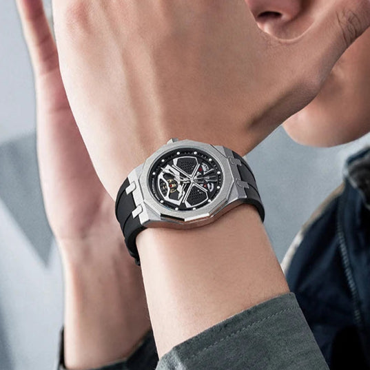 Lifestyle wrist shot of Mark Fairwhale FW5590 AERIX hollow dial men’s chronograph watch with silicone strap