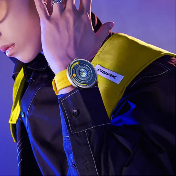 Luxury Earth-inspired Fairwhale THÉO watch on wrist with bold yellow strap