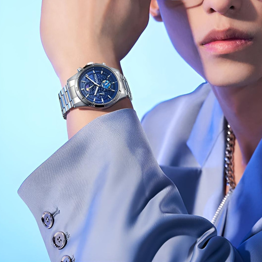 Man wearing Mark Fairwhale 5022 VELTRONIX watch with blue celestial dial, styled with a modern suit.