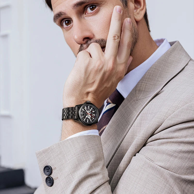 Man wearing Mark Fairwhale CHRONIXA 5750 black chronograph watch with suit – luxury men’s wristwatch