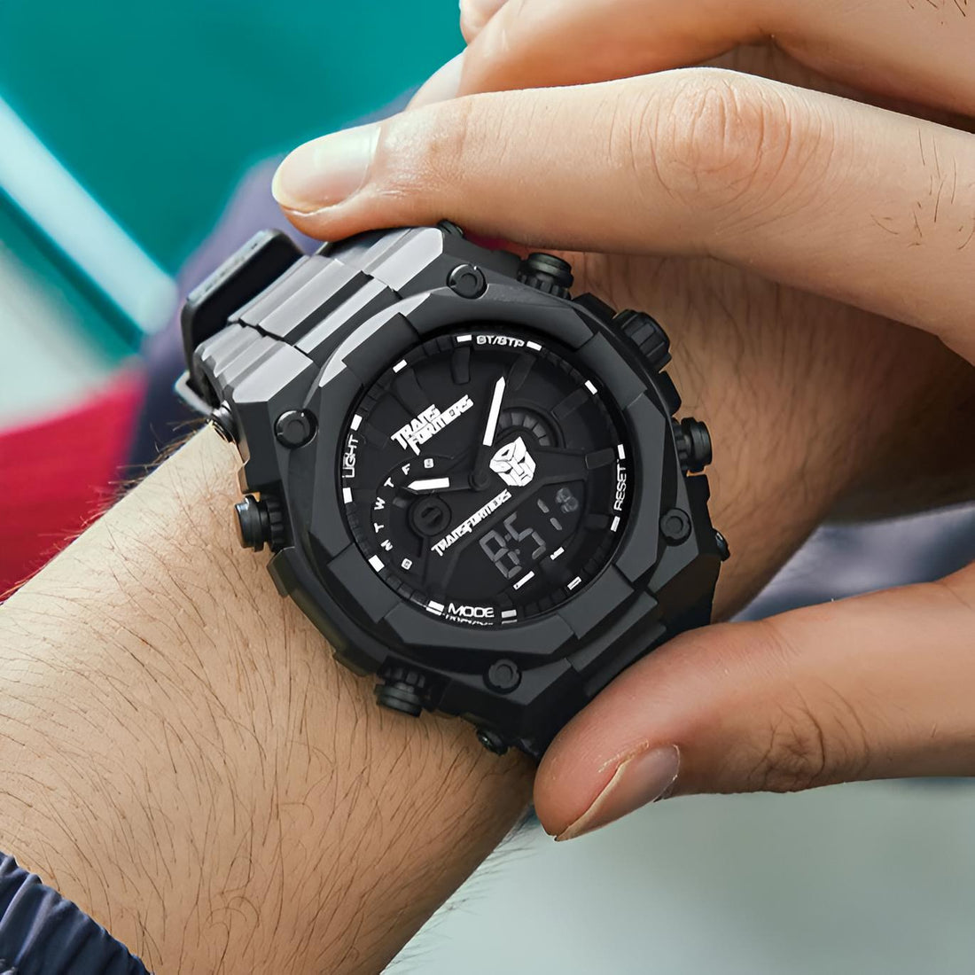 Mark Fairwhale 7110 Transformers - Black transparent digital quartz watch displayed with robotic background