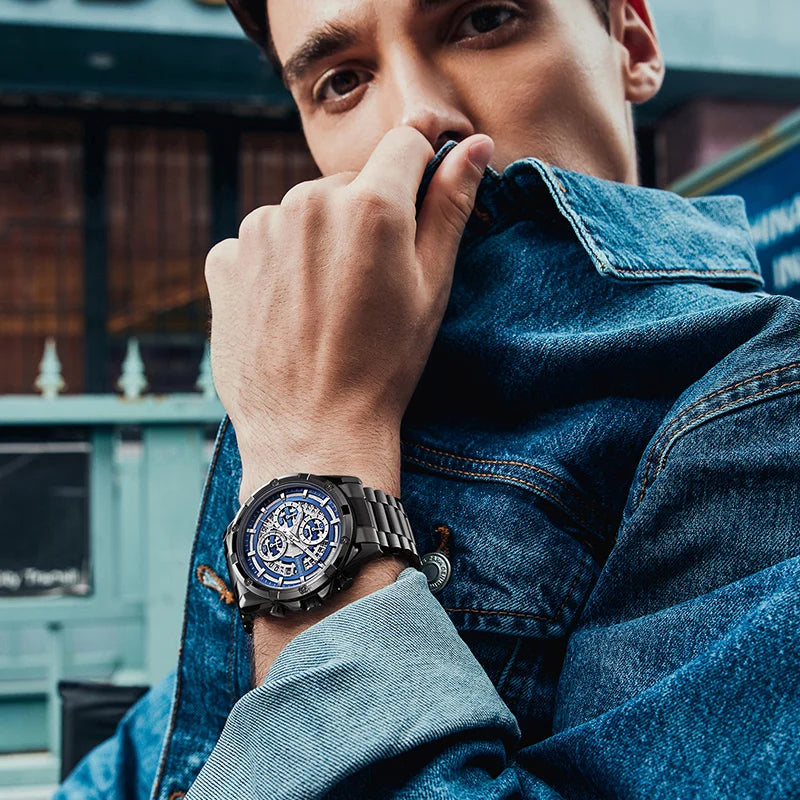 Stylish man wearing the Mark Fairwhale NOVATRIX 5430 chronograph watch with stainless steel bracelet, luxury street style shot.