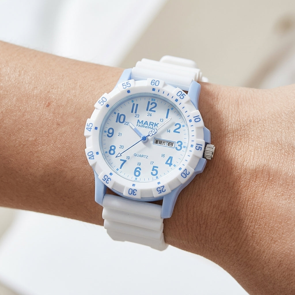 White and blue watch on a wrist with a blurred background