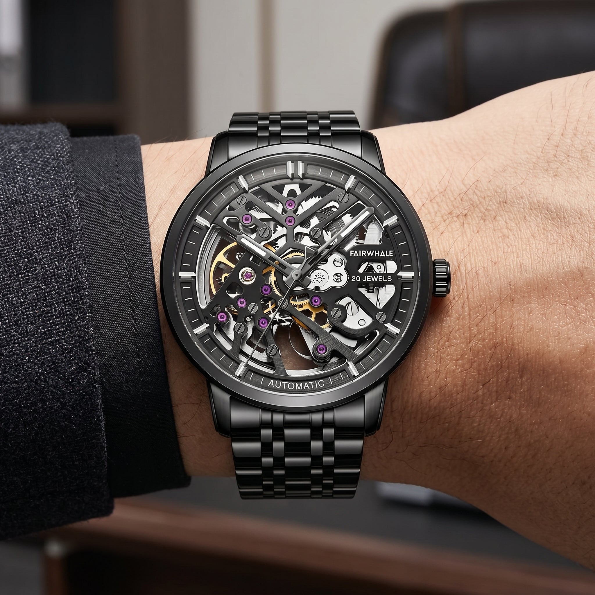 Mark Fairwhale men’s black skeleton watch with exposed movement and jewels, stainless steel bracelet, wrist close-up