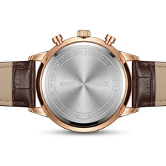 Back view of a Mark Fairwhale watch with brown leather strap and rose gold case.