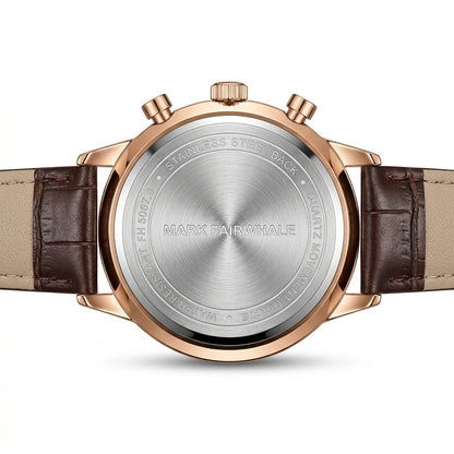 Back view of a Mark Fairwhale watch with brown leather strap and rose gold case.