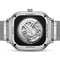 Back view of a silver watch with visible mechanical components on a white background