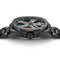 Black wristwatch with detailed face on a white background
