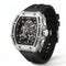 Black and silver watch with visible mechanical components on a white background