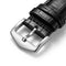 Black leather watch strap with silver buckle on a white background