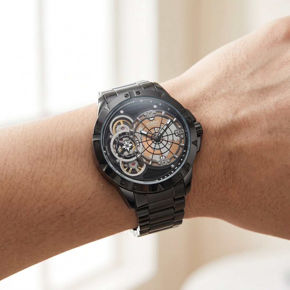Black mechanical watch on a wrist with a blurred background