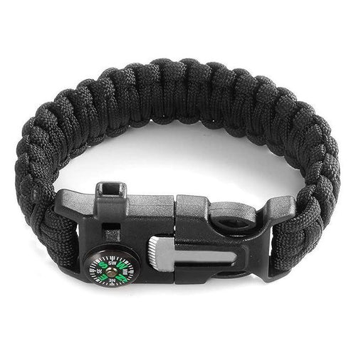 Black paracord bracelet with a compass and buckle on a white background