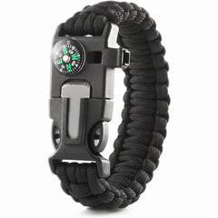 Black paracord bracelet with compass and tool functions on a white background