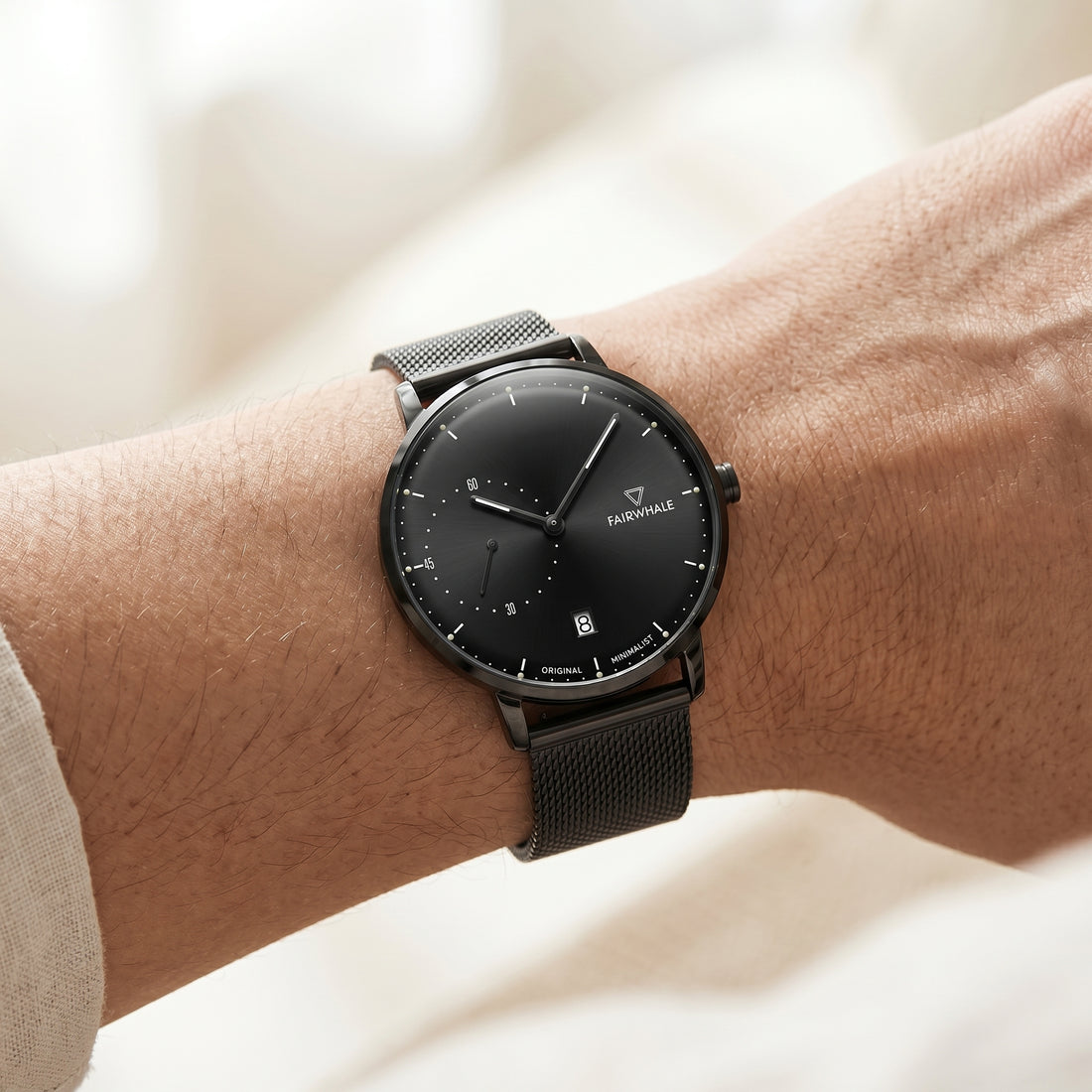 Black watch on a wrist with a blurred background
