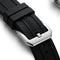 Black watch strap with silver clasp on a white background