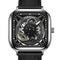 Black wristwatch with visible mechanical components on a white background