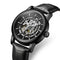 Black wristwatch with visible mechanical components on a white background