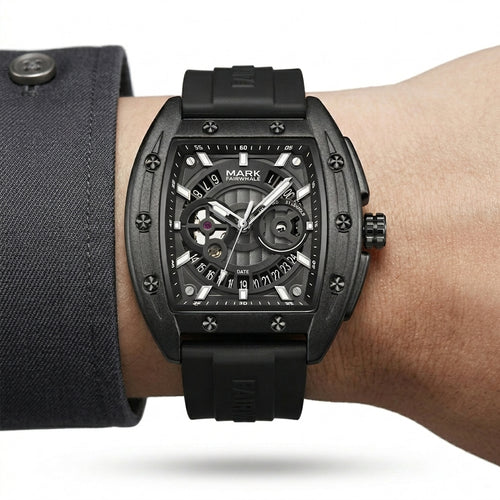 Black wristwatch with detailed design on a person&