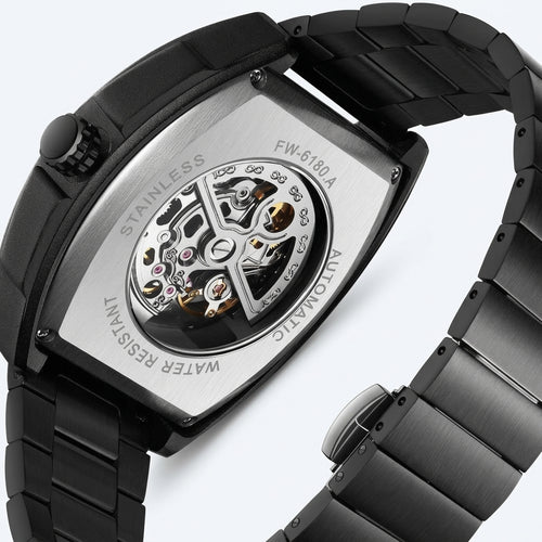 Black wristwatch with mechanical components on a white background