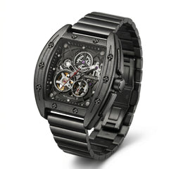 Black wristwatch with visible mechanical components on a white background