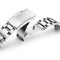 Close-up of a silver watch strap on a white background