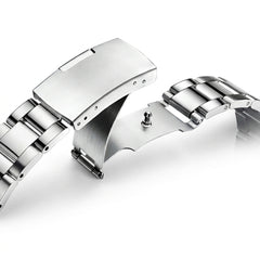 Close-up of a silver watch strap on a white background
