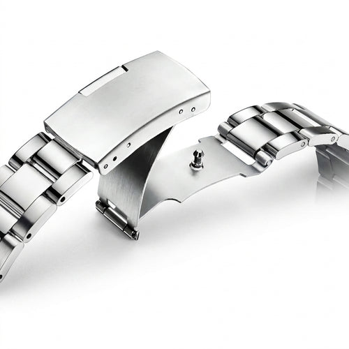 Close-up of a silver watch strap on a white background