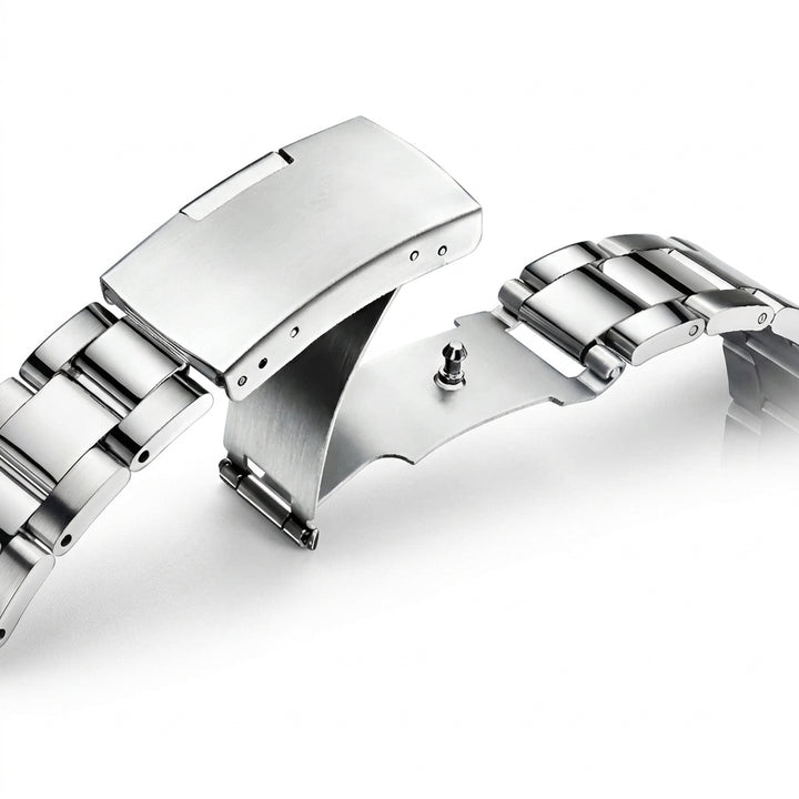 Close-up of a silver watch strap on a white background