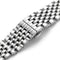 Close-up of a silver metal watch strap on a white background