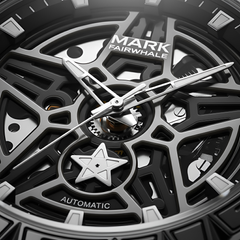 Close-up of a Mark Fairwhale watch with intricate design and visible brand name.