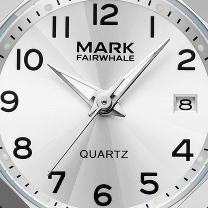 Close-up of a Mark Fairwhale watch face with black numbers and hands on a white background.