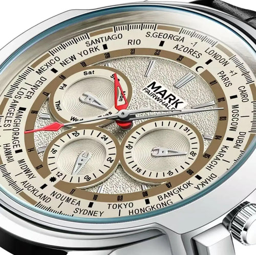 Close-up of a Mark Fairwhale watch with world time display
