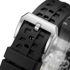 Close-up of a black watch strap with a silver buckle on a white background