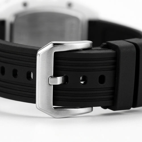 Close-up of a black watch strap with a silver buckle on a white background