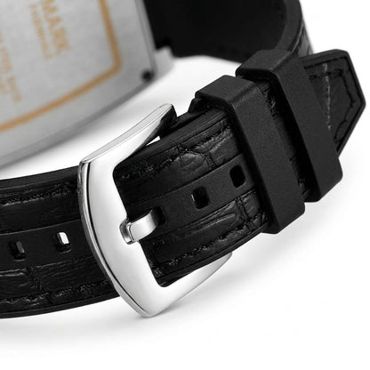 Close-up of a black leather watch strap with a silver buckle on a white background