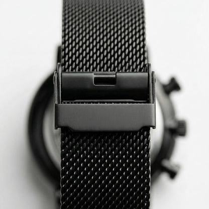 Close-up of a black mesh watch strap with &