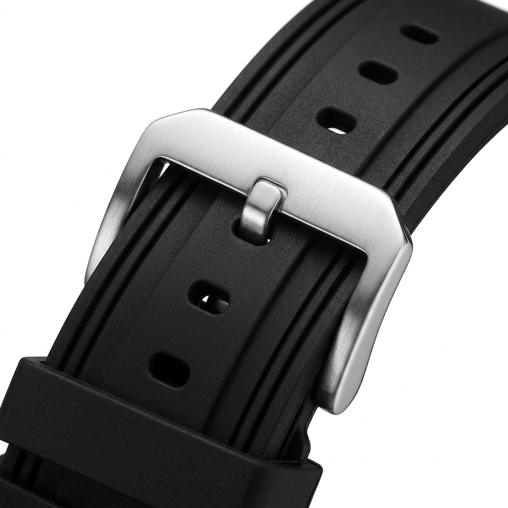 Close-up of a black watch strap with a silver buckle on a white background