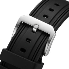 Close-up of a black watch strap with a silver buckle on a white background