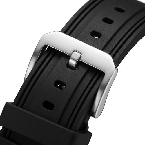 Close-up of a black watch strap with a silver buckle on a white background