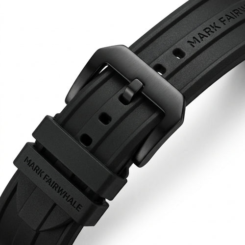 Close-up of a black watch strap with &