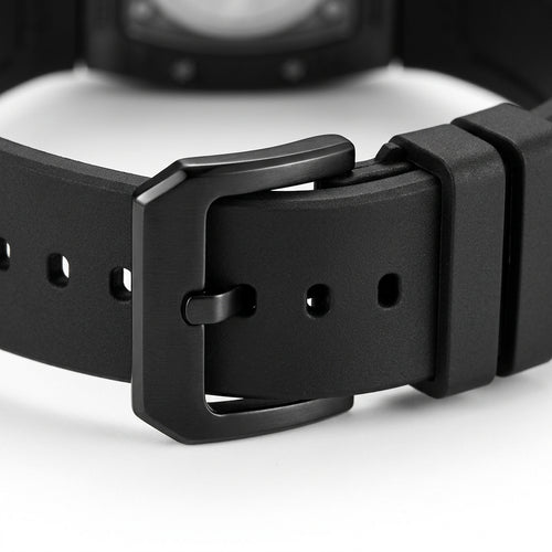 Close-up of a black watch strap with a buckle on a white background