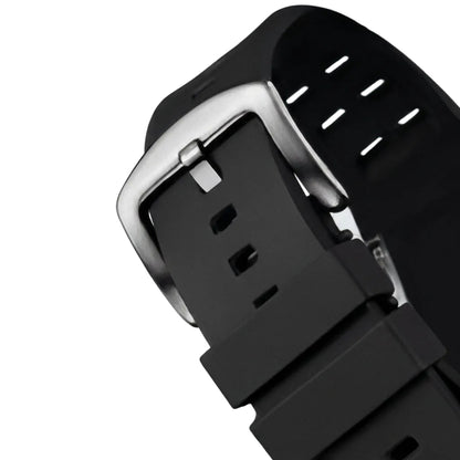 Close-up of a black watch strap with a silver buckle on a light gray background