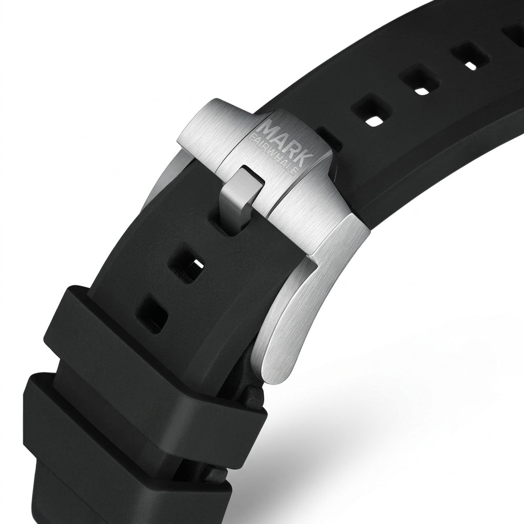 Close-up of a black watch strap with a silver clasp on a white background