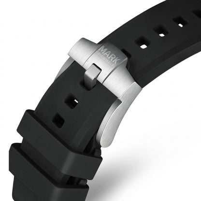 Close-up of a black watch strap with a silver clasp on a white background