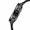 Close-up of a black wristwatch on a white background