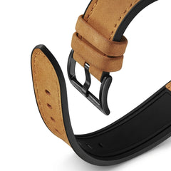 Close-up of a brown leather watch strap with black metal clasp on a white background