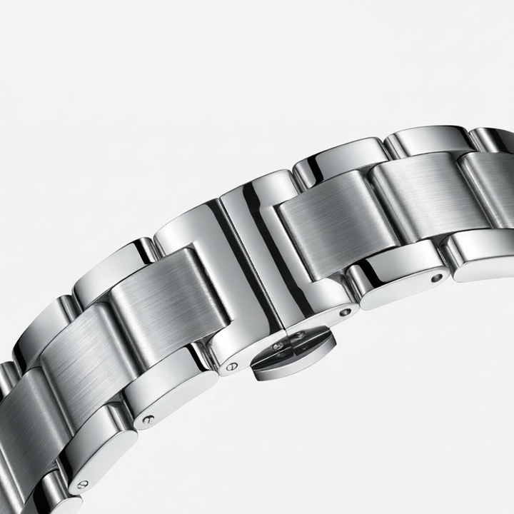 Close-up of a silver metal watch bracelet on a white background
