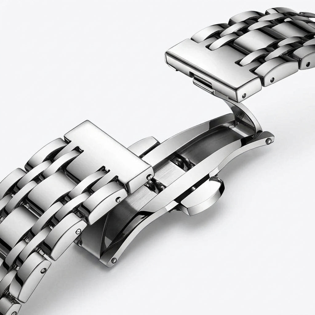 Close-up of a silver metal watch strap on a white background