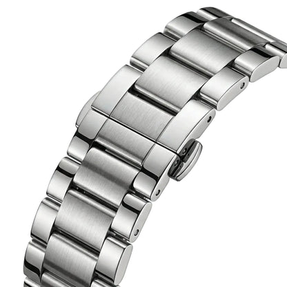 Close-up of a silver metal watch strap on a light gray background
