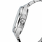 Close-up of a silver watch with a white background